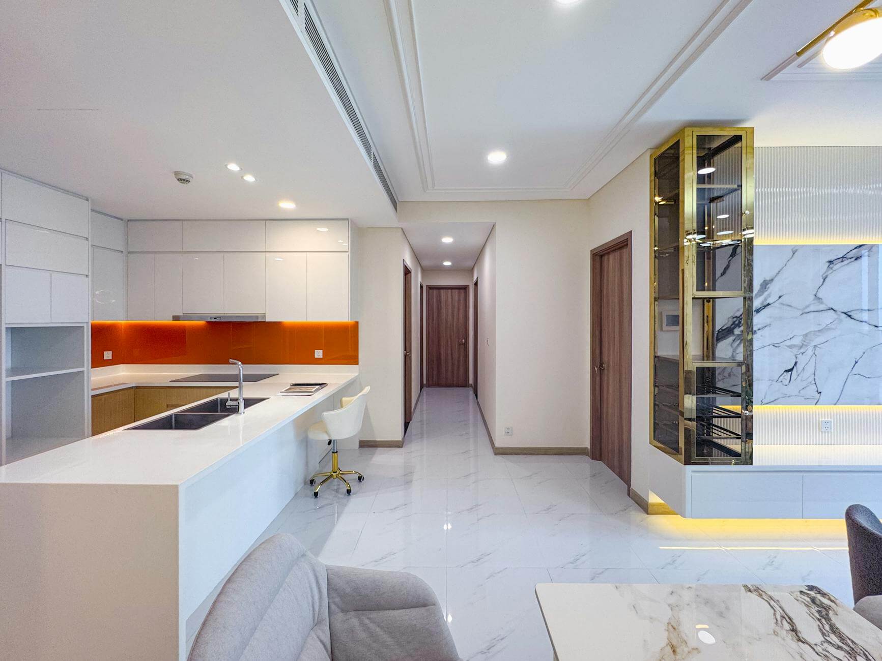 modern kitchen and living space with marble decor